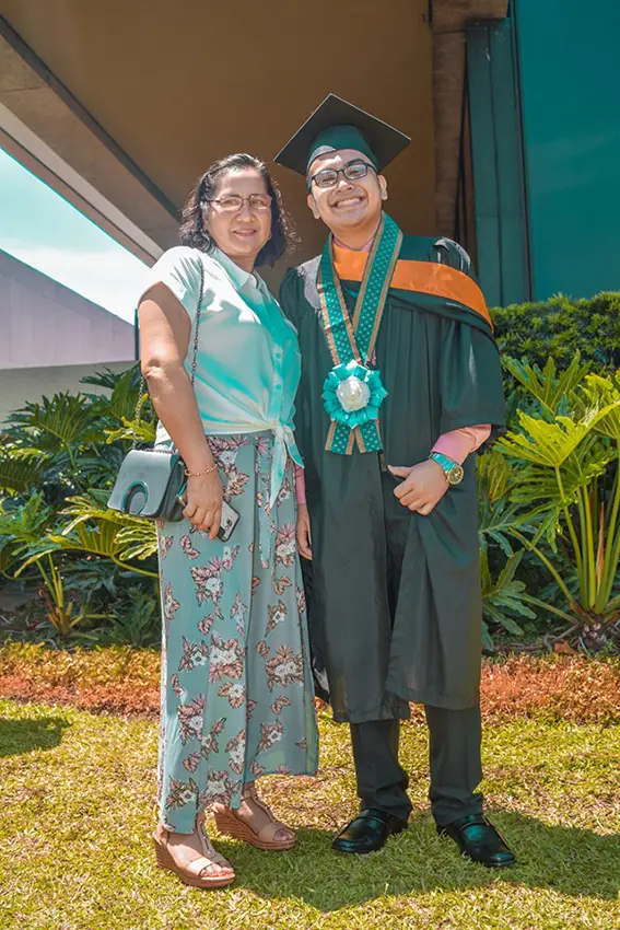 A Graduate Wearing Lei Garland By Letrato